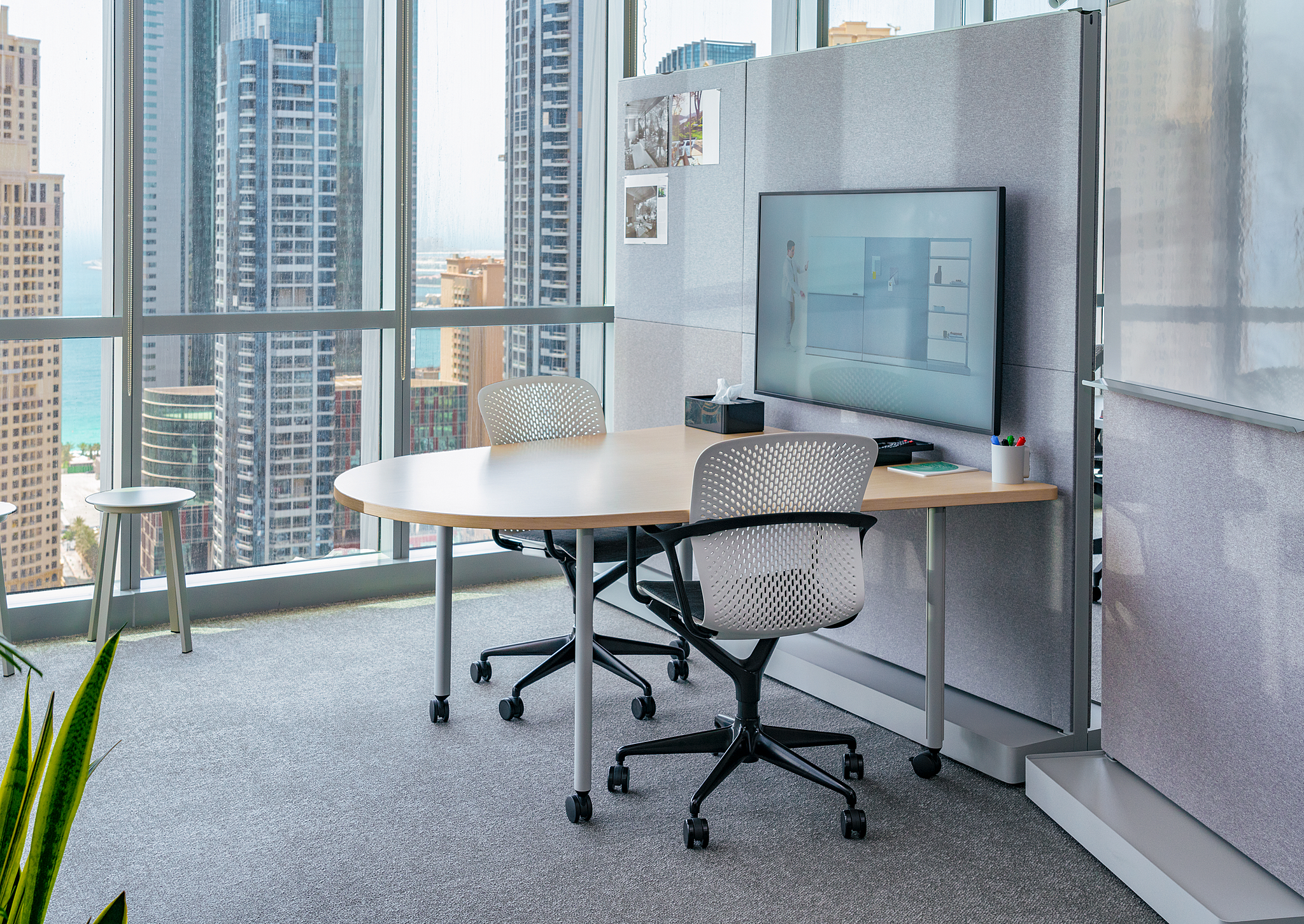 Small conference room table with video display board